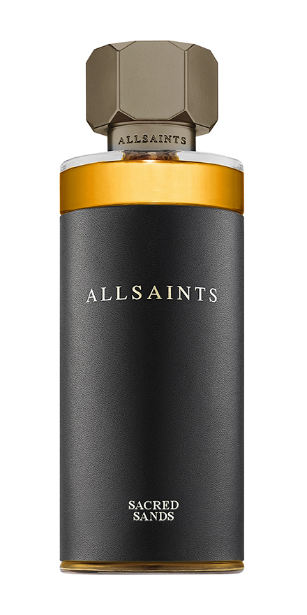 AllSaints Sacred Sands perfume bottle with a black matte body, amber liquid, and a geometric gold cap with ALLSAINTS on the bottle neck.