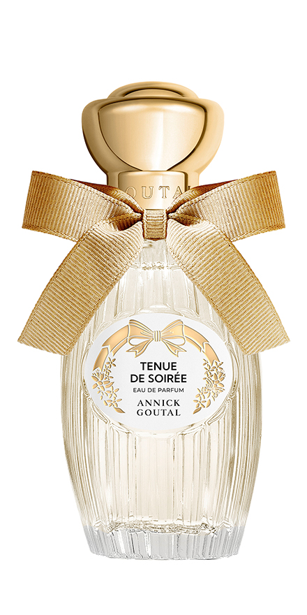 Glass perfume bottle with a gold cap and beige ribbon, labeled Tenue de Soirée by Annick Goutal.